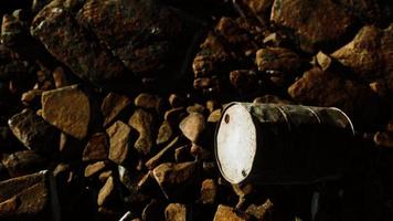 rusty destroyed metal barrel on beach rocks video