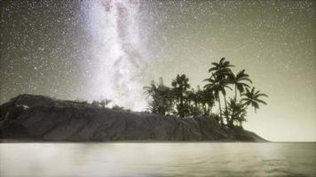 Beautiful fantasy tropical beach with Milky Way star in night skies video