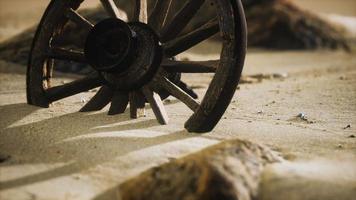 Large wooden wheel in the sand video