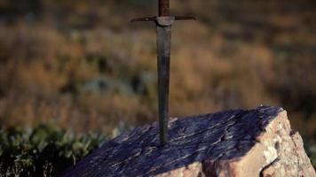 famous sword excalibur of King Arthur in the rock video