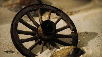 Large wooden wheel in the sand video