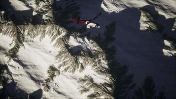 helicopter above mountains in snow video