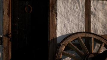 old wood wheel and black door at white house video