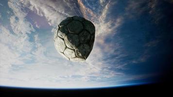 old soccer ball in space on Earth orbit video