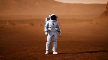 Astronaut on Mars Surface. Red Planet Covered in Gas and rock video