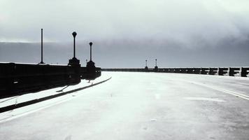 View of the bridge over the river in fog video