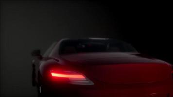 luxury sport car in dark studio with bright lights video