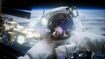 Astronaut at spacewalk. Elements of this image furnished by NASA video