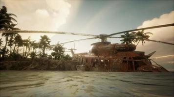 old rusted military helicopter near the island video