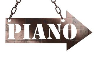 piano word on metal pointer photo