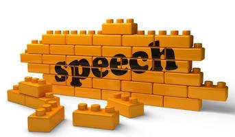 speech word on yellow brick wall photo