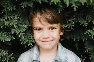 portrait kid boy plant photo