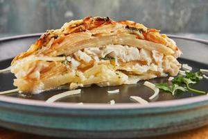 Fish gratin with potatoes and apples. Gourmet French food