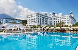 Swimming pool and beach of luxury hotel. Type entertainment complex. Amara Dolce Vita Luxury Hotel. Resort. Tekirova-Kemer