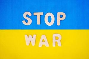words No War from individual letters on the background of the flag of Ukraine photo