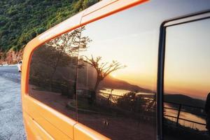 Fantastic paved road along the coast, and cars photo