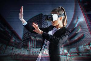 Young girl getting experience VR headset, is using augmented reality eyeglasses, being in a virtual reality. In city at night photo