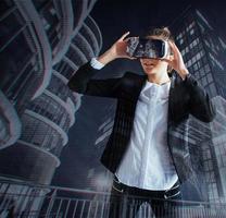 Young girl getting experience VR headset, is using augmented reality eyeglasses, being in a virtual reality. In city at night photo