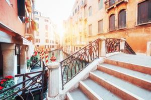 Gondolas on canal in Venice. Venice is a popular tourist destination of Europe. photo