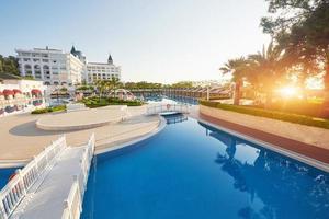The popular resort Amara Dolce Vita Luxury Hotel. With pools and water parks and recreational area along the sea coast in Turkey at sunset. Tekirova-Kemer