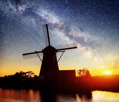 Dutch mill at night. Starry sky. Holland. Netherlands photo