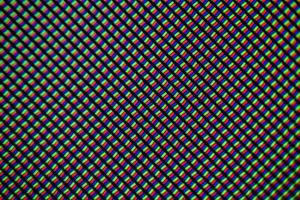 Light photomicrograph of a mobile LCD screen seen through a microscope photo
