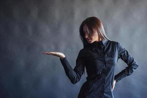 Portrait of beautiful smart young businesswoman in business attire photo