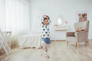 Cute little girl dreams of becoming a ballerina. Girl studying ballet. photo