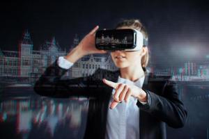 Young girl getting experience VR headset, is using augmented reality eyeglasses, being in a virtual reality. In city at night photo