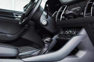 Luxury car Interior - steering wheel, shift lever and dashboard photo