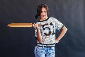 Beautiful young woman with a wooden board photo