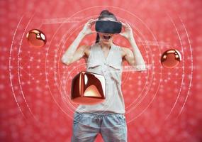 Visual reality concept. Young man using Visual reality or VR headset and interacting with object. photo