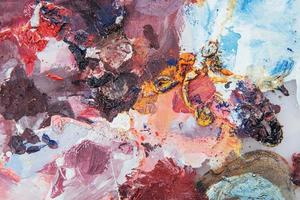Abstract art background. Oil painting on canvas. Multicolored bright texture. Fragment of artwork. Spots of oil paint. Brushstrokes of paint. photo