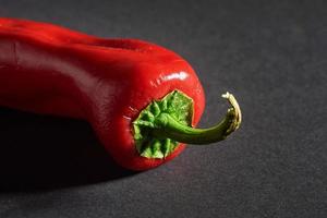 Red chili peppers isolated on a black background