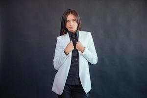 Portrait of beautiful smart young businesswoman in business attire photo