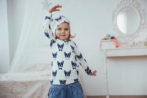 Cute little girl dreams of becoming a ballerina. Girl studying ballet. photo