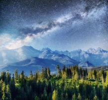 Starry sky and Milky Way over mountains Carpathians. Ukraine photo