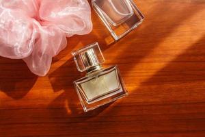 perfume on wooden background photo