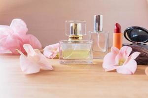 Perfume  and makeup cosmetics on wooden  background photo