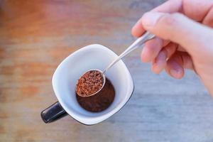 coffee powder in a spoon photo
