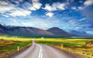 Asphalt road to the mountains Iceland. photo