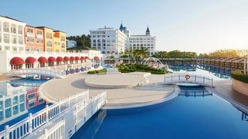 Swimming pool and beach of luxury hotel and outdoor pools and a spa. Amara Dolce Vita Luxury Hotel. Resort. Tekirova-Kemer. Turkey.