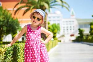 Portrait of a happy child wearing sunglasses outdoors in summer day. Amara Dolce Vita Luxury Hotel. Resort. Tekirova-Kemer. Turkey. photo