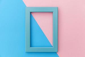 Simply design with empty blue frame isolated on pink and blue pastel colorful background. Top view, flat lay, copy space, mock up. Minimal concept. photo