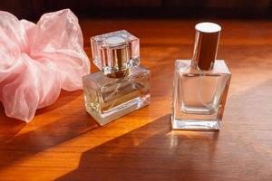 perfume on wooden background photo