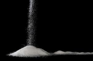 sugar trickles with black background photo