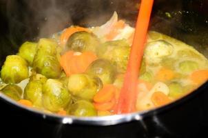 boiling vegetables in the kitchen photo