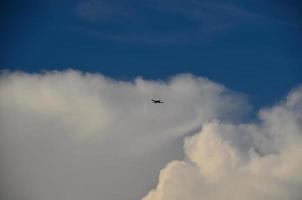 small aircraft and clouds photo