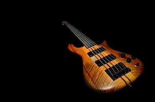 bass guitar with black background photo