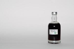 ribwort plantain syrup on white photo